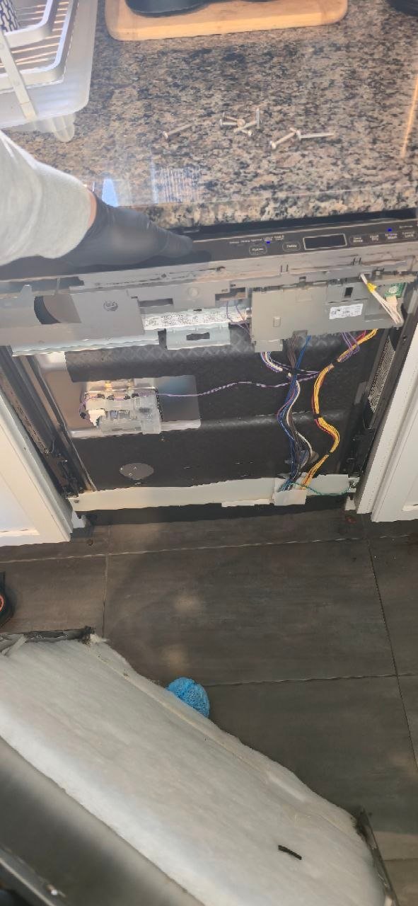Dishwasher inner door panel removed exposing the main control board and wiring harness during electronic diagnostics by Caspian Appliance Repair Hamilton