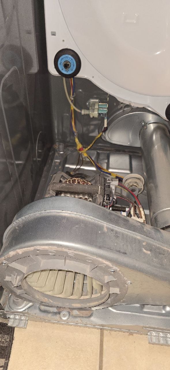 Dryer drive motor and blower wheel exposed for diagnostic testing during repair service by Caspian Appliance Repair in Hamilton, Ontario