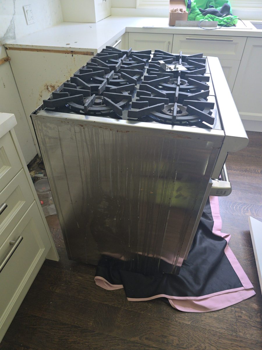 Gas range pulled out for oven repair in Hamilton, Ontario